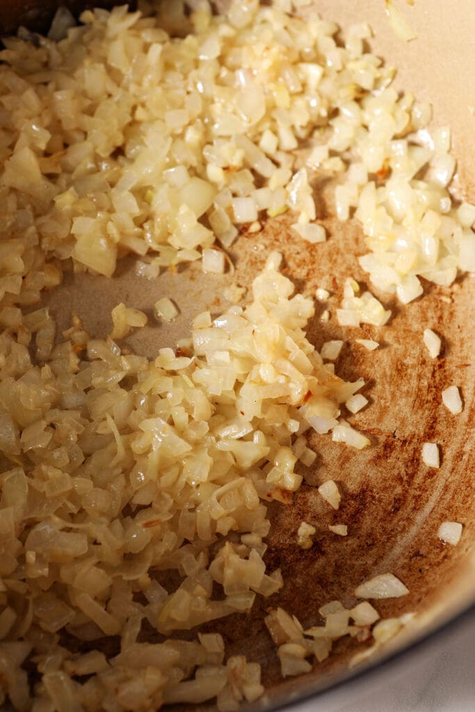 Chopped onion and garlic in a dutch oven, after cooking