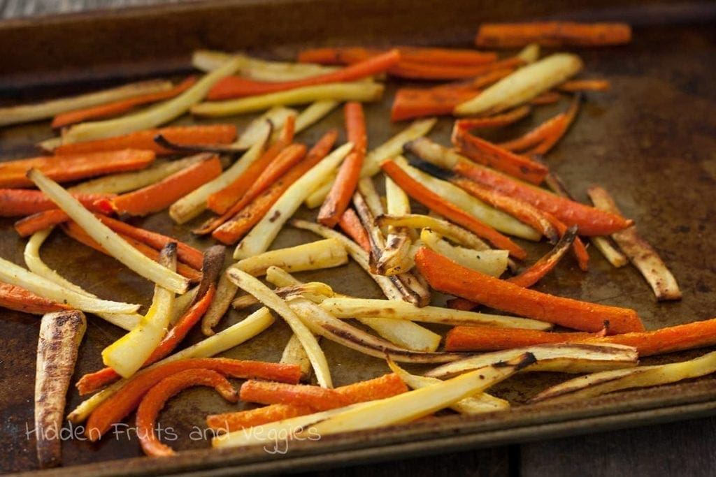 Parsnip fries on a baking sheet