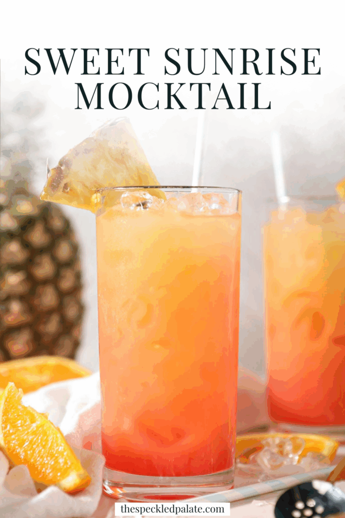 Two orange-pink mocktails garnished with pineapples with the text Sweet Sunrise Mocktail