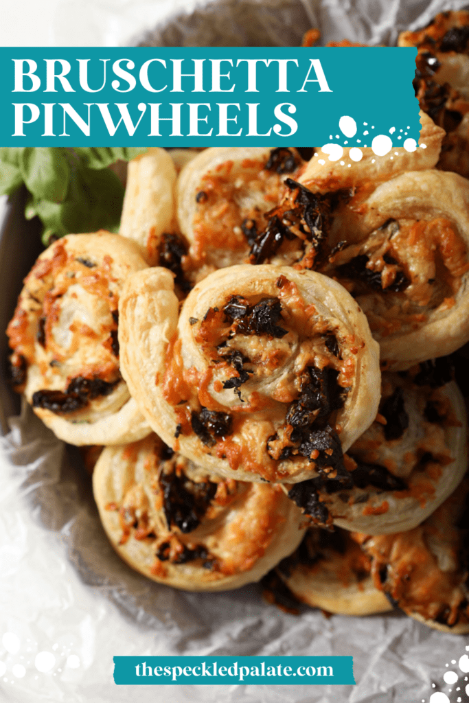 Close up of puff pastry pinwheels in a bowl from above with the text bruschetta pinwheels