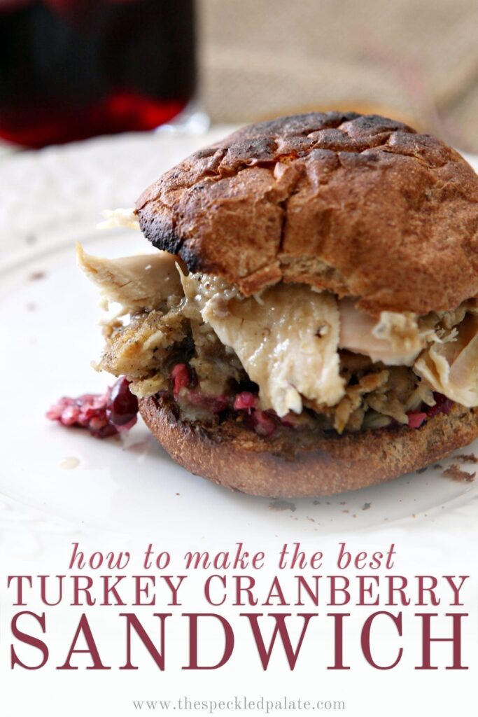 Close up of a sandwich with cranberry, turkey, stuffing and more with the text 'how to make the best turkey cranberry sandwich'