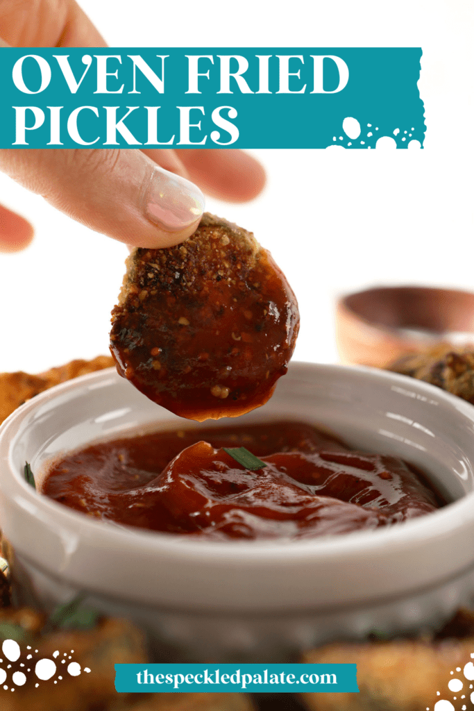 a hand dips a pickle chip into a red dipping sauce with the text oven fried pickles