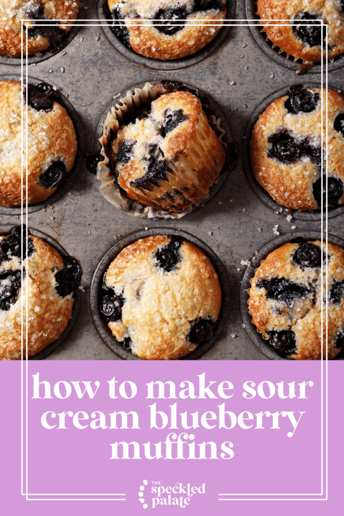 Sour Cream Blueberry Muffins in a muffin tin after baking with the text how to make sour cream blueberry muffins