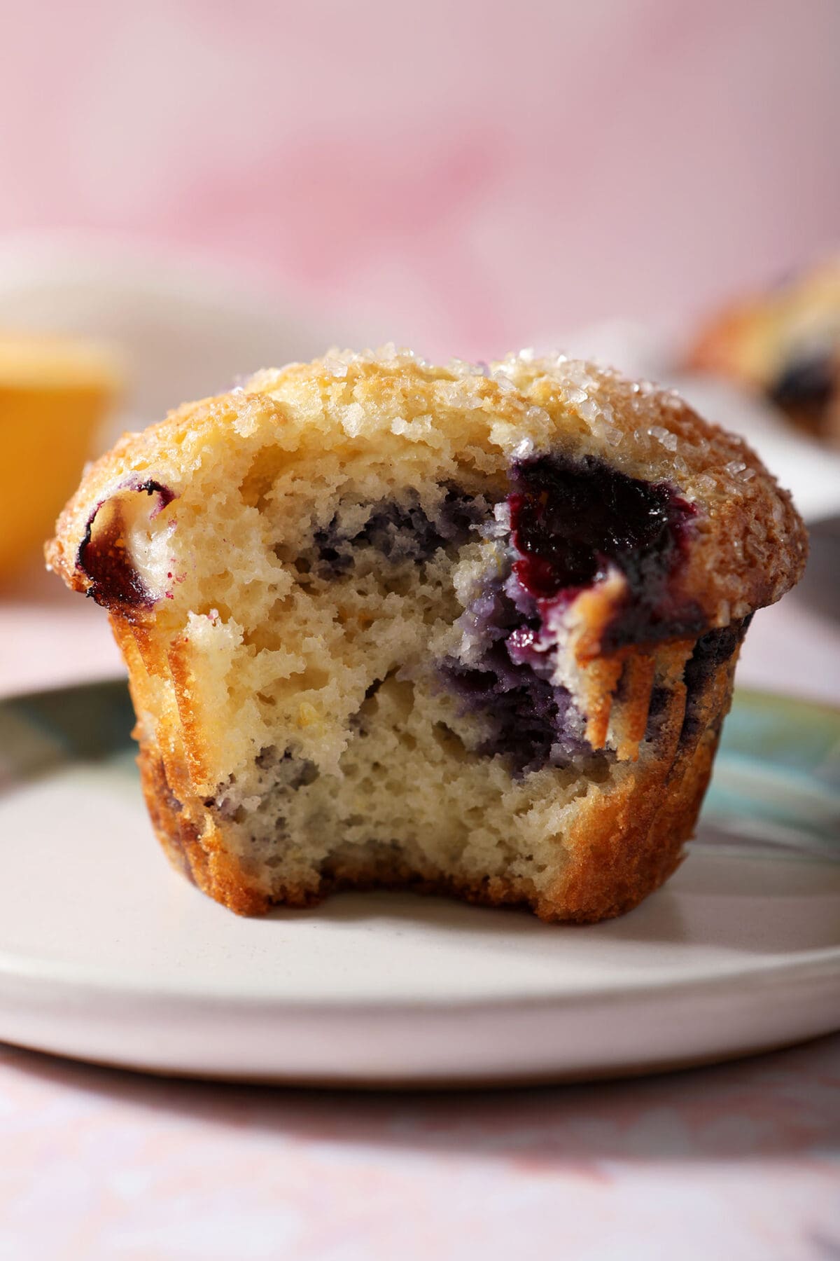 Close up of a Sour Cream Blueberry Muffin on a plate