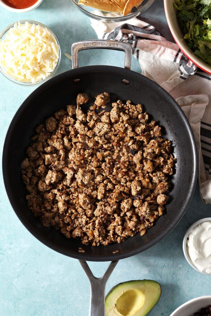 Ground turkey with onions cooked in a saucepan