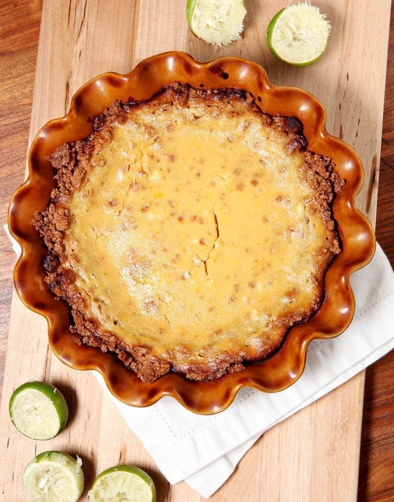 overhead of key lime pie in a brown pie plate