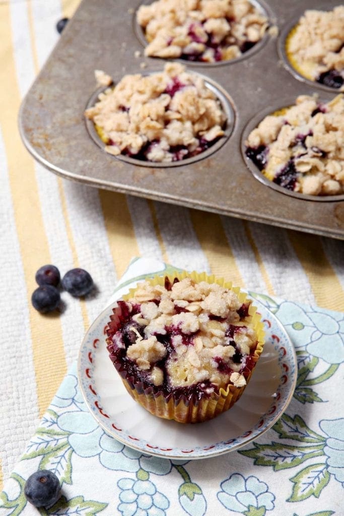 lemon blueberry crumble muffin on small plate