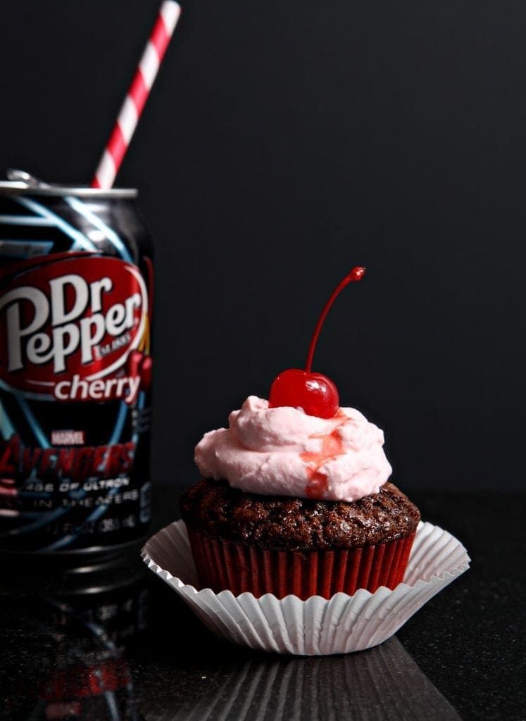 close up of cupcake with dr. pepper and a cherry