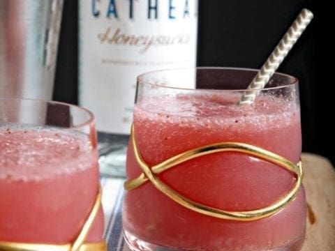 A cup of coffee on a table, with Honeysuckle Vodka