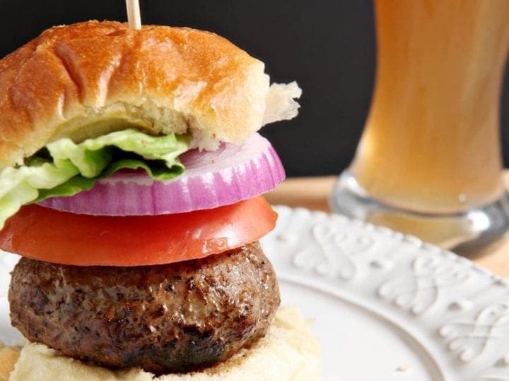A sandwich on a plate, with Juicy Lucy burger