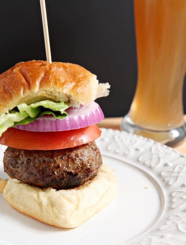 A sandwich on a plate, with Juicy Lucy burger