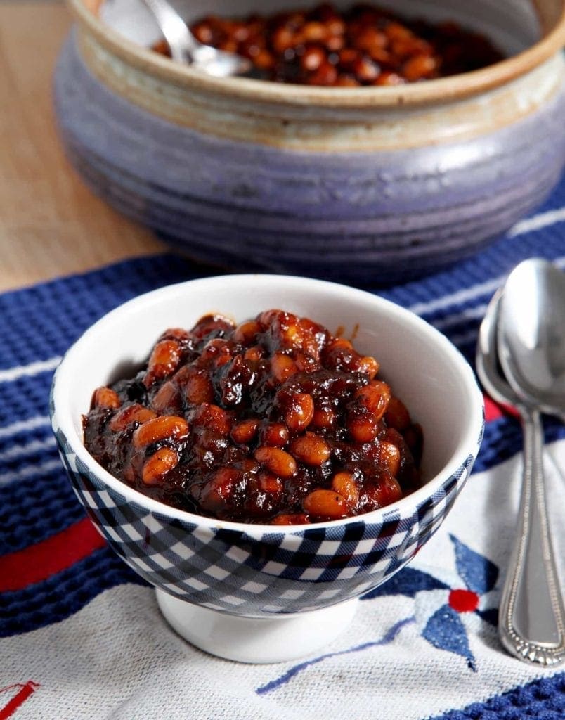 Sweetened with honey and barbecue sauce and spiced with Sriracha, these Sriracha Baked Beans are a tasty side dish for any summertime get-together.
