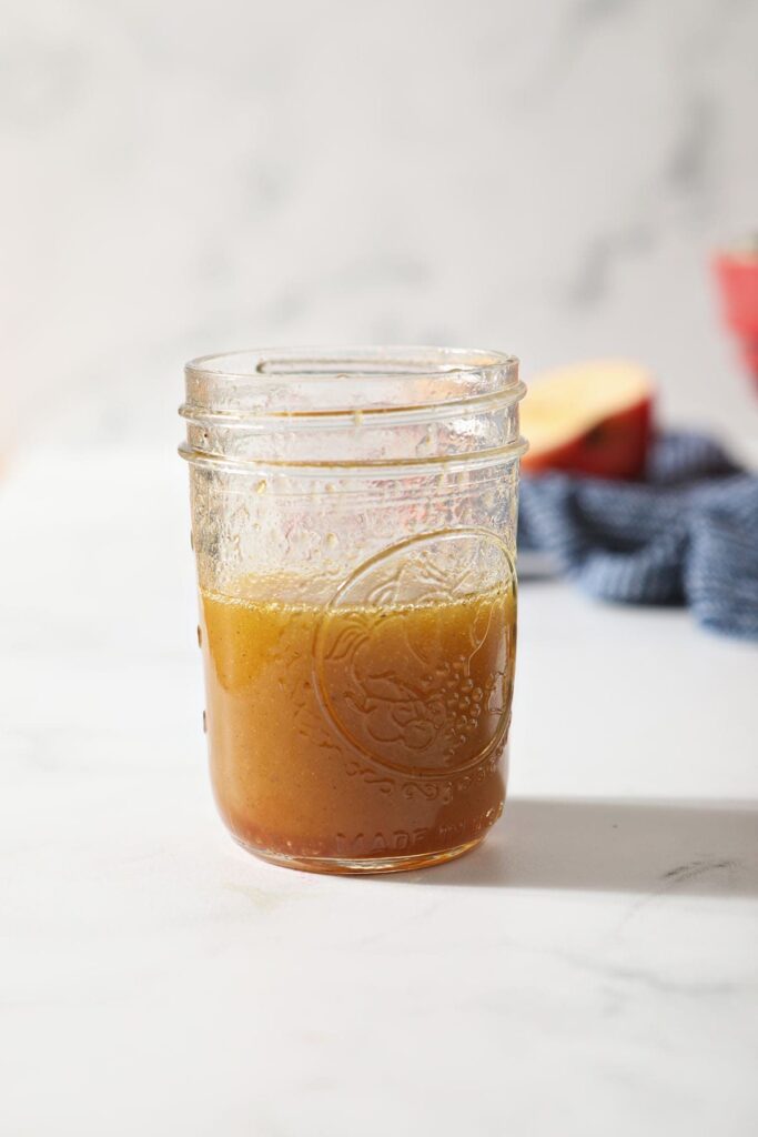 A honey vinaigrette on a marble countertop