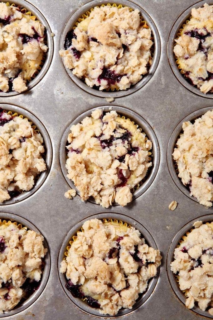 A pan full of Dairy-Free Blueberry Lemon Crumble Muffins, straight out of the oven