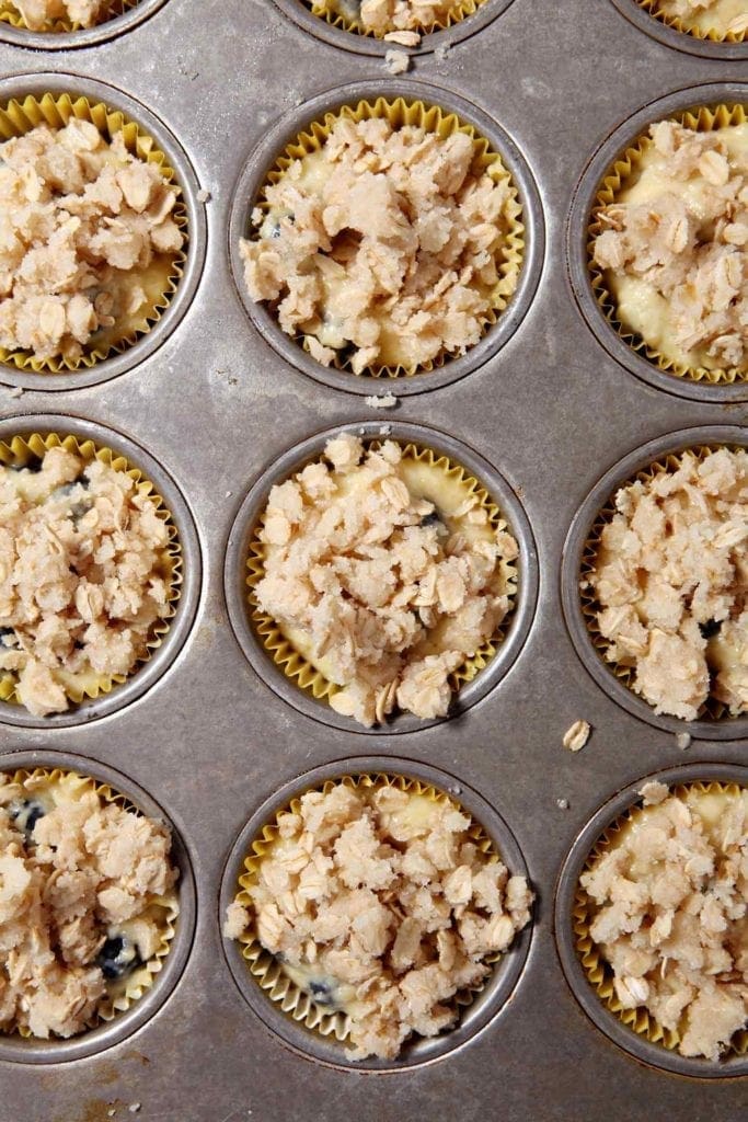 A pan of Dairy-Free Blueberry Lemon Crumble Muffins, before baking