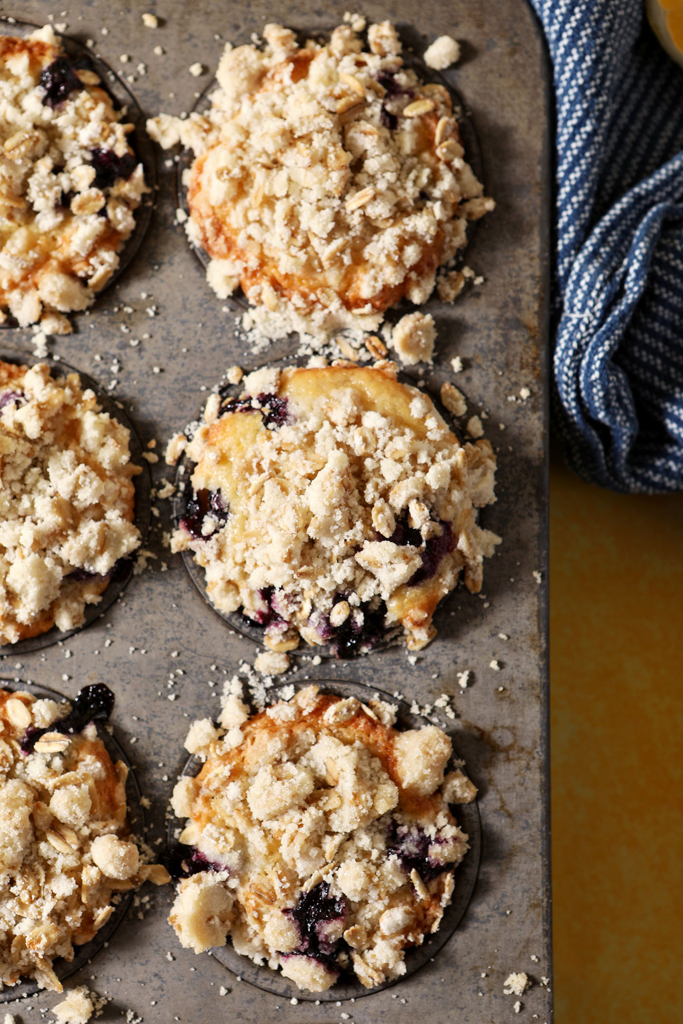 Lemon Blueberry Muffins with Streusel Topping in a muffin tin from above