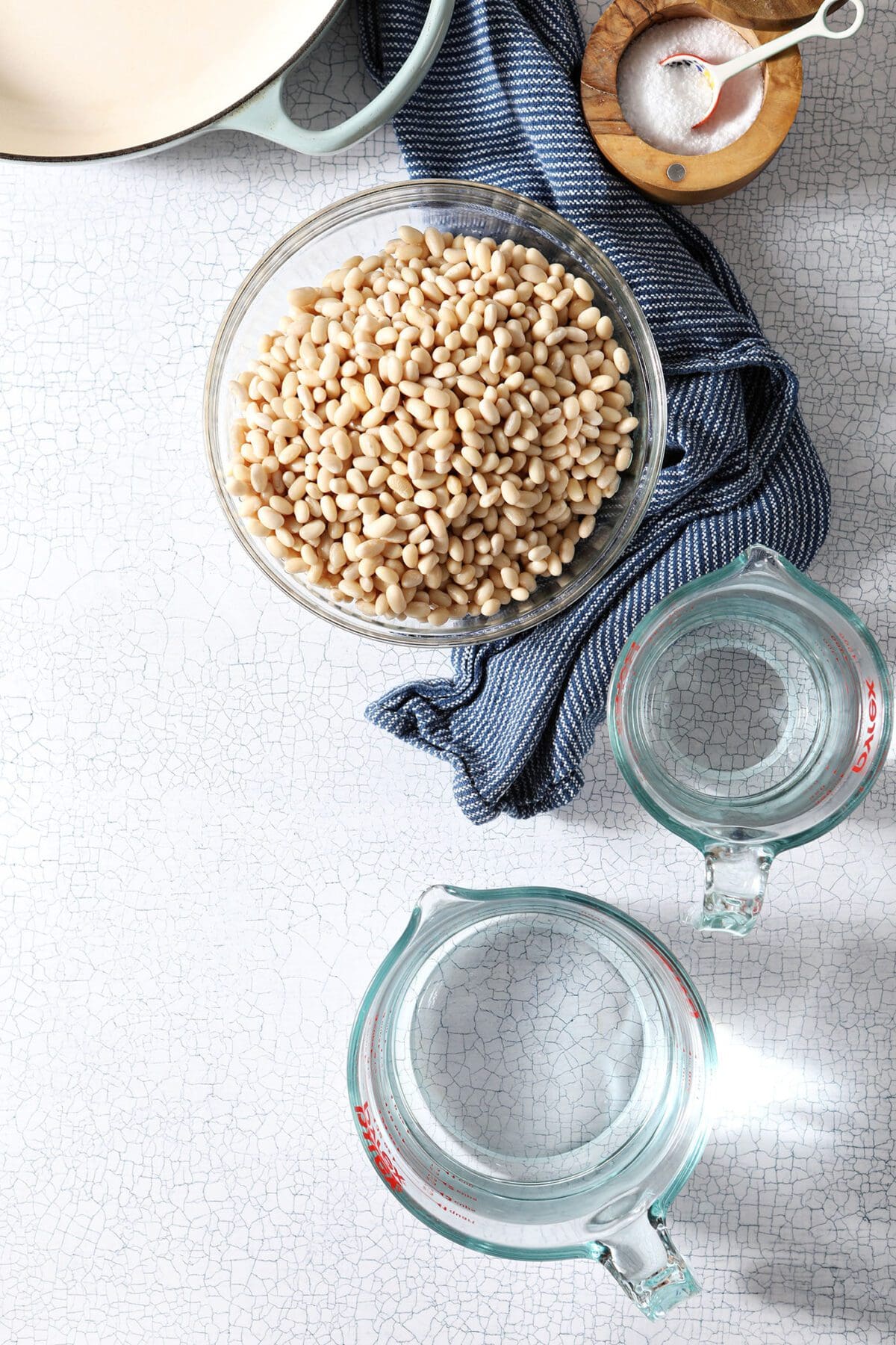 Bowls holding beans and water to make homemade baked beans