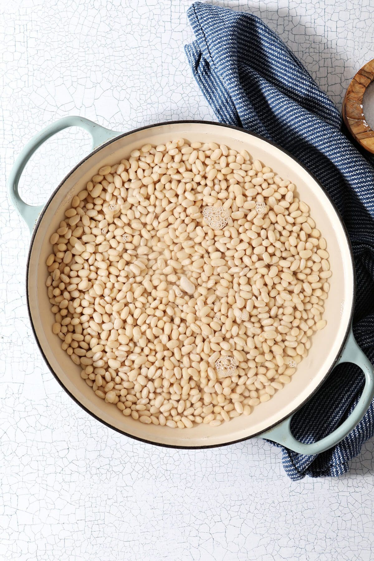 Beans in a braised pan with water before cooking