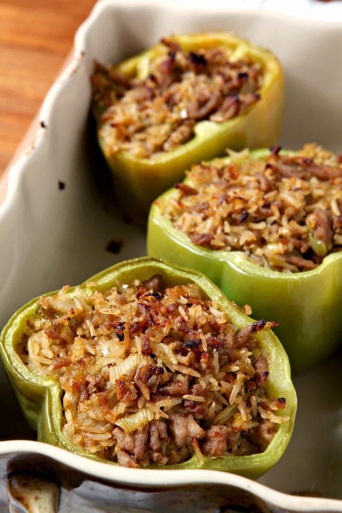 Close up of cooked stuffed bell peppers in dish 