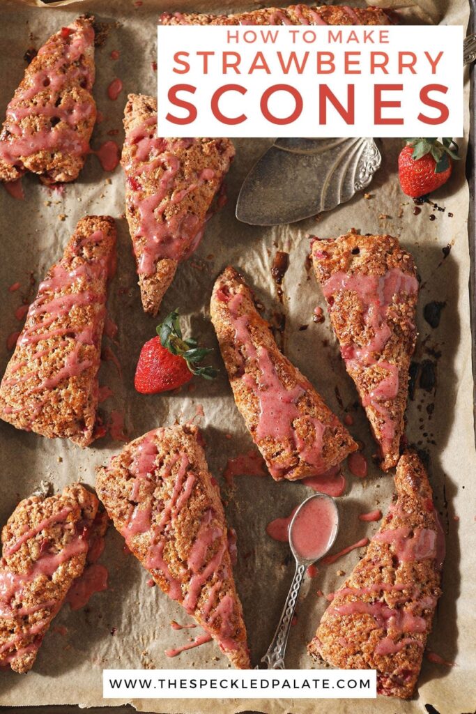 A baking sheet holds various glazed Strawberry Scones with fresh strawberries on it with the text 'how to make strawberry scones'