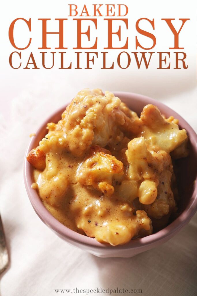 Close up of a bowl of cheesy cauliflower with the text baked cheesy cauliflower