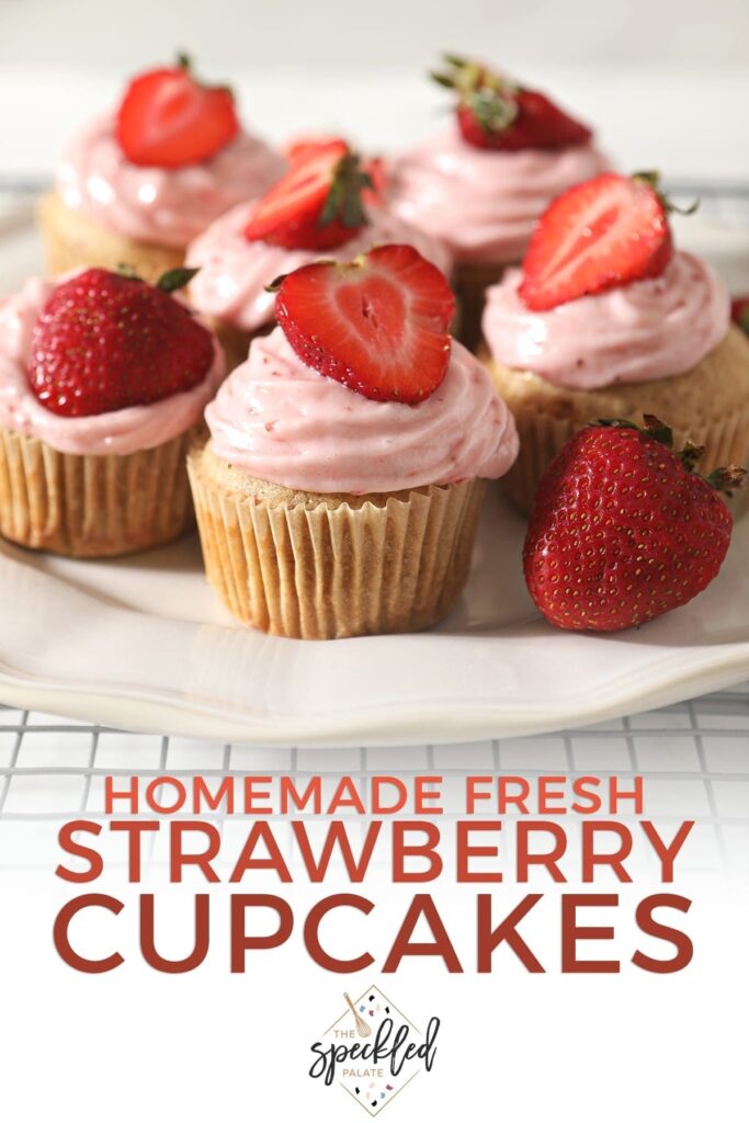 Decorated Strawberry Cupcakes on a white platter with the text 'homemade fresh strawberry cupcakes'