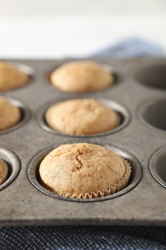 Baked strawberry cupcakes in a muffin tin after baking