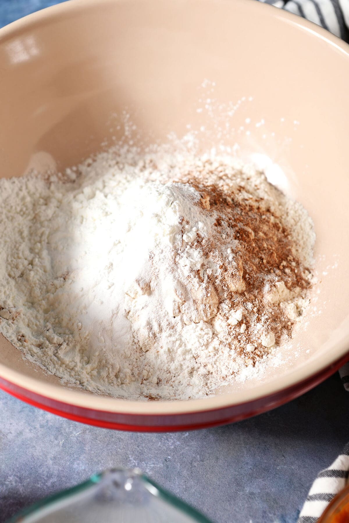 Dry ingredients in a bowl on a blue surface