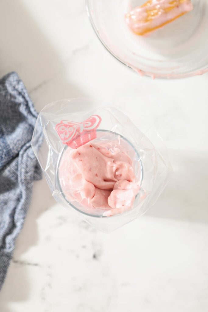 Strawberry Cream Cheese Frosting in a frosting bag