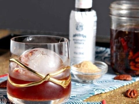 Close up of a Toasted Pecan Old Fashioned in decorative glass 