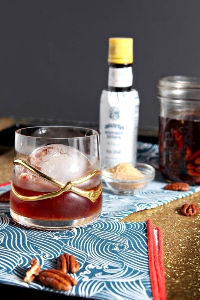 Close up of a Toasted Pecan Old Fashioned in decorative glass 