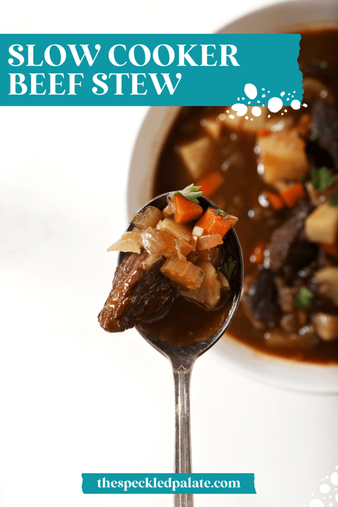 a spoon holds a bite of stew over a bowl with the text slow cooker beef stew