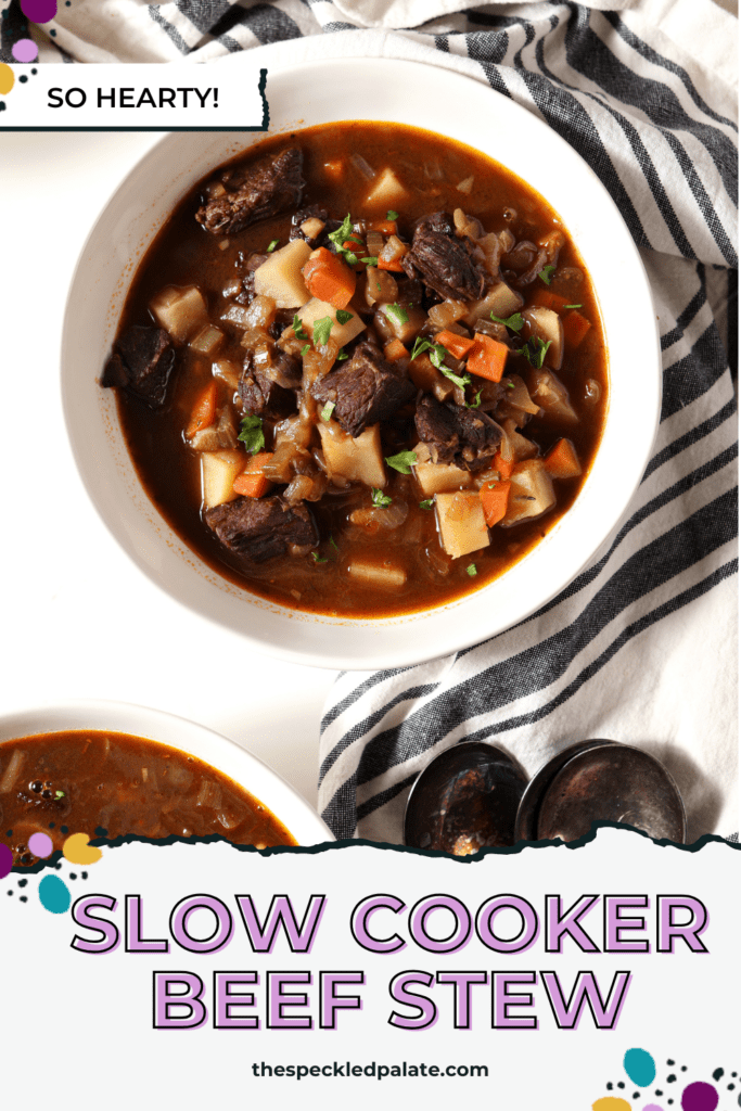 Close up of a bowl of beef stew on a marble surface with the text slow cooker beef stew