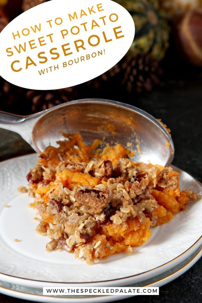 A silver serving spoon scoops a serving of Bourbon Sweet Potato Casserole onto a white plate with the text 'how to make sweet potato casserole with bourbon'