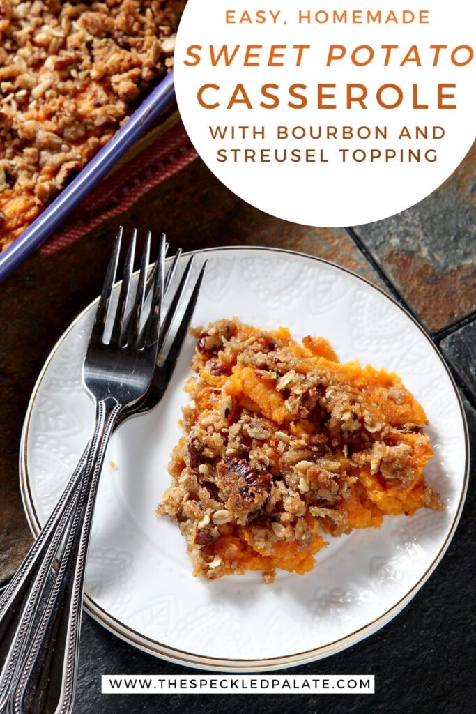 Close up of a white plate holding a serving of Bourbon Sweet Potato Casserole next to two silver forks with the text 'easy, homemade sweet potato casserole with bourbon and streusel topping'