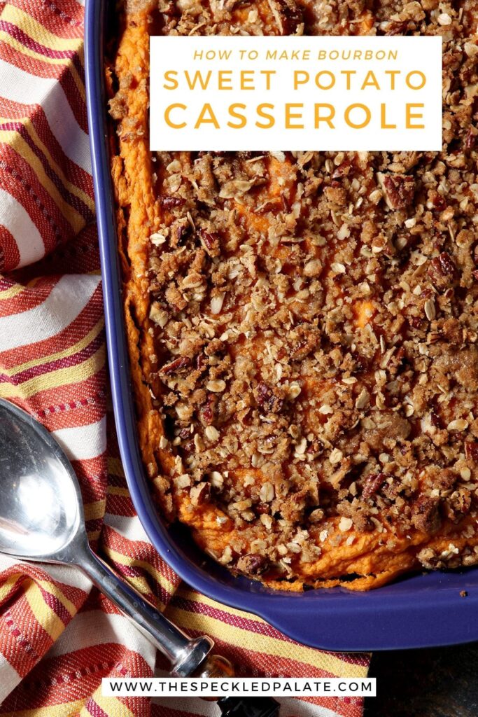 Close up of a casserole dish holding baked Bourbon Sweet Potato Casserole next to a silver serving spoon with the words 'how to make bourbon sweet potato casserole'