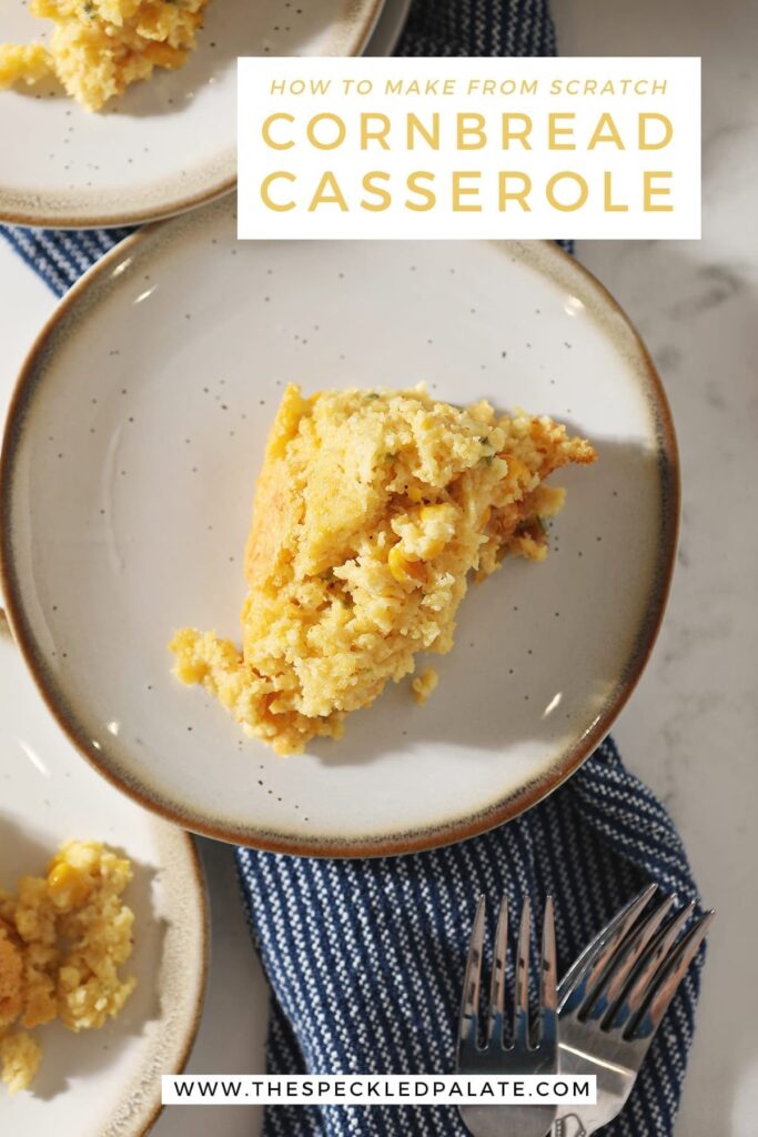 Closeup image of cornbread casserole on a white plate on top of a blue towel with the text 'how to make from scratch cornbread casserole'