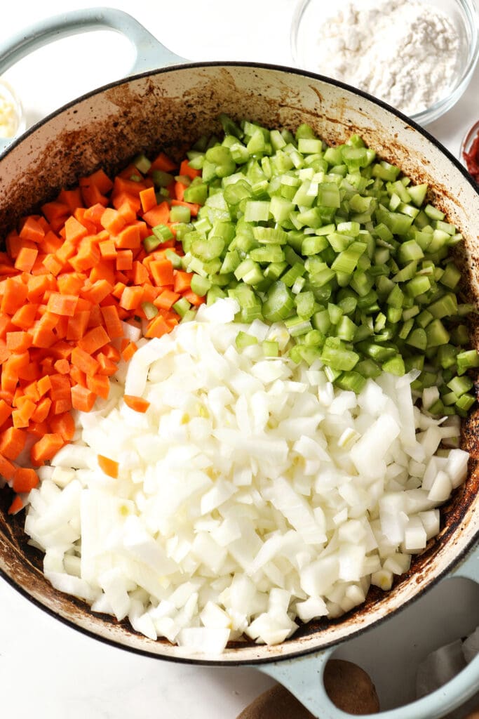 Chopped onions, carrots and celery in a skillet