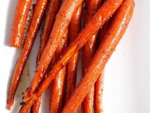 Overhead close up of roasted carrots on dish