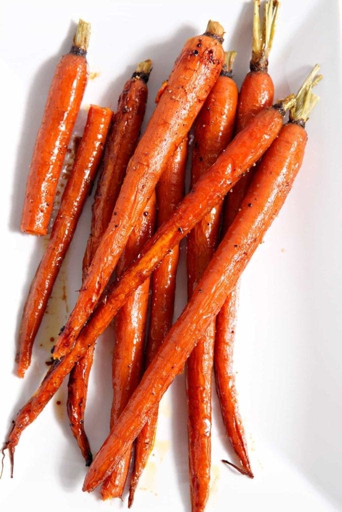 Overhead close up of roasted carrots on dish 