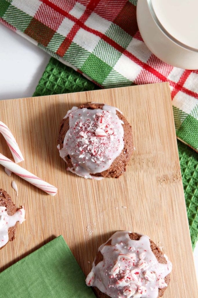 Cookies with peppermint icing on wood board 