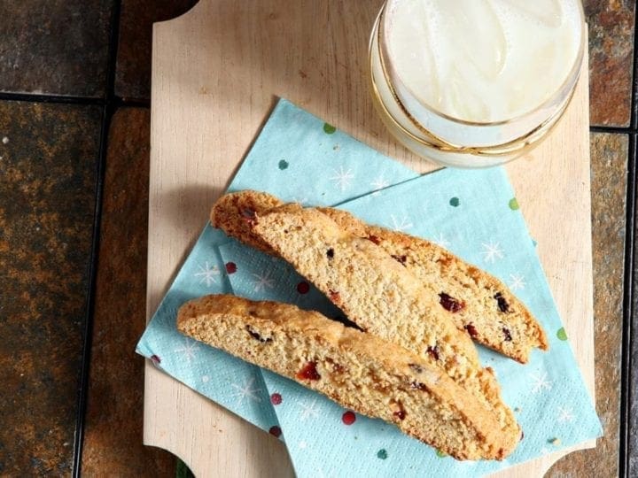 Perfectly crunchy cookies are chock full of cranberries, orange and ginger goodness to make these beautiful Cranberry Orange Ginger Biscotti. This biscotti is the perfect cookie for any non-chocolate lover.
