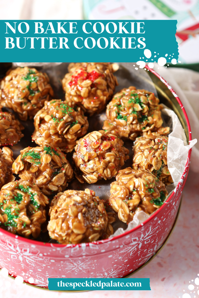 A cookie tin of Christmas-colored No Bake cookies on a pink terrazzo surface with the text no bake cookie butter cookies