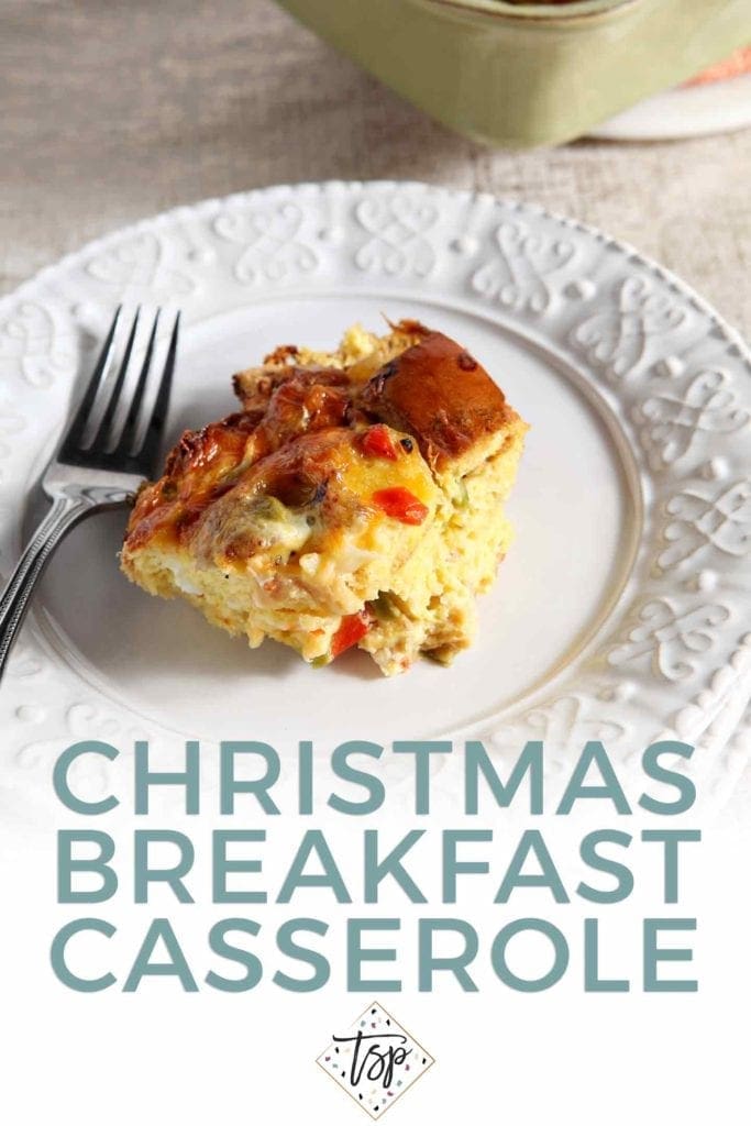 Pinterest graphic for Christmas Breakfast Casserole, featuring a serving of the casserole on a white plate with a fork