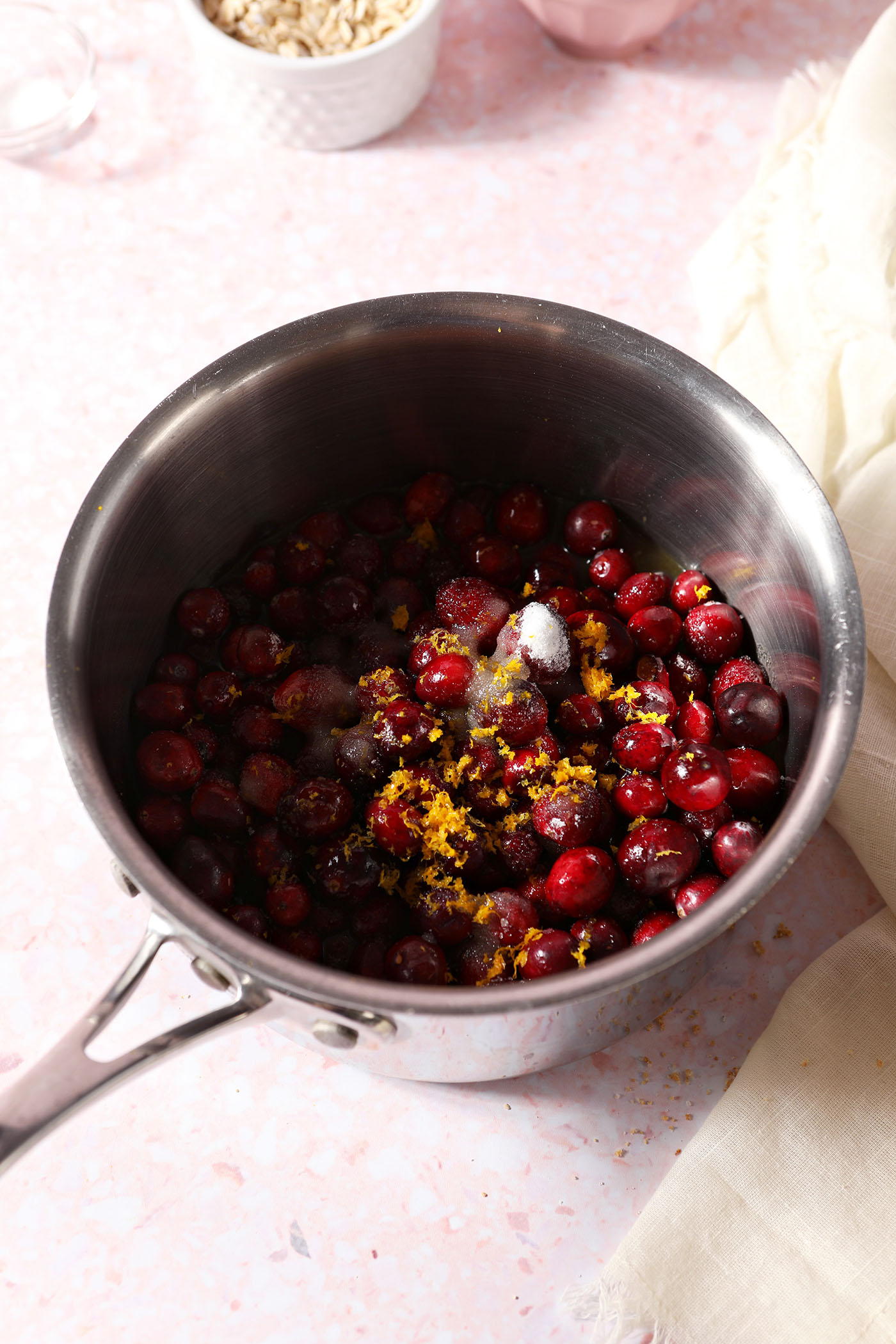 Ingredients to make the cranberry filling in a saucepan before cooking down