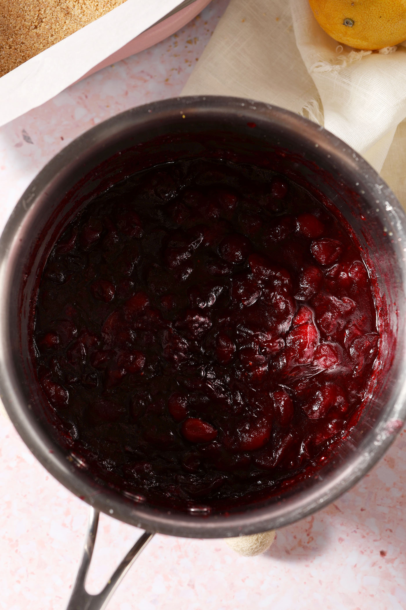 The cranberry filling in a saucepan after cooking down