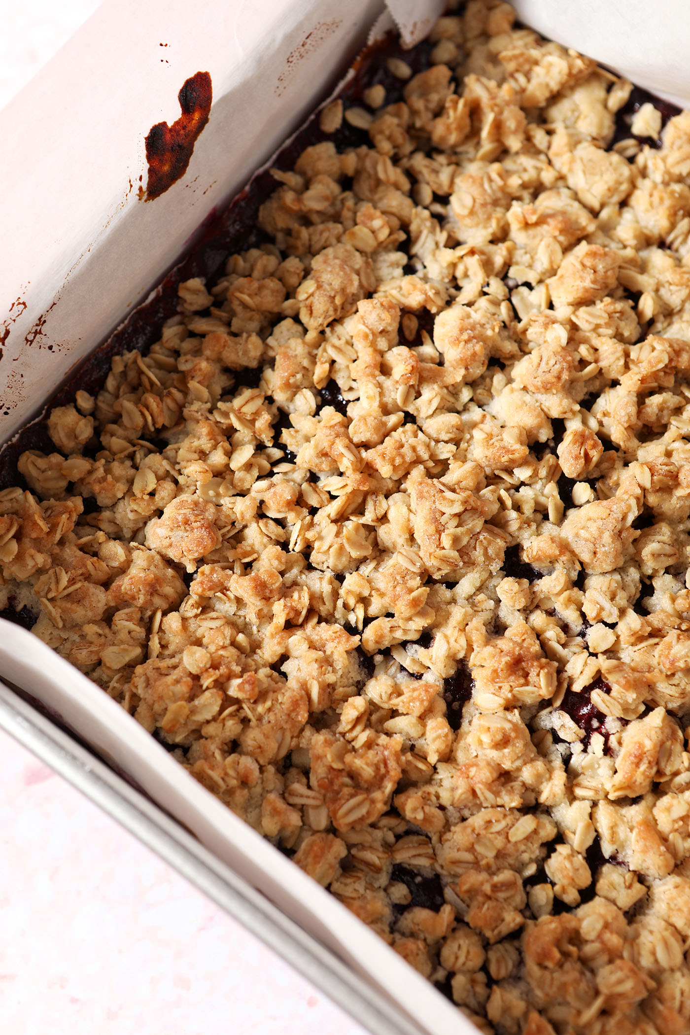 A baked square of Cranberry Bars with a Crumble Topping
