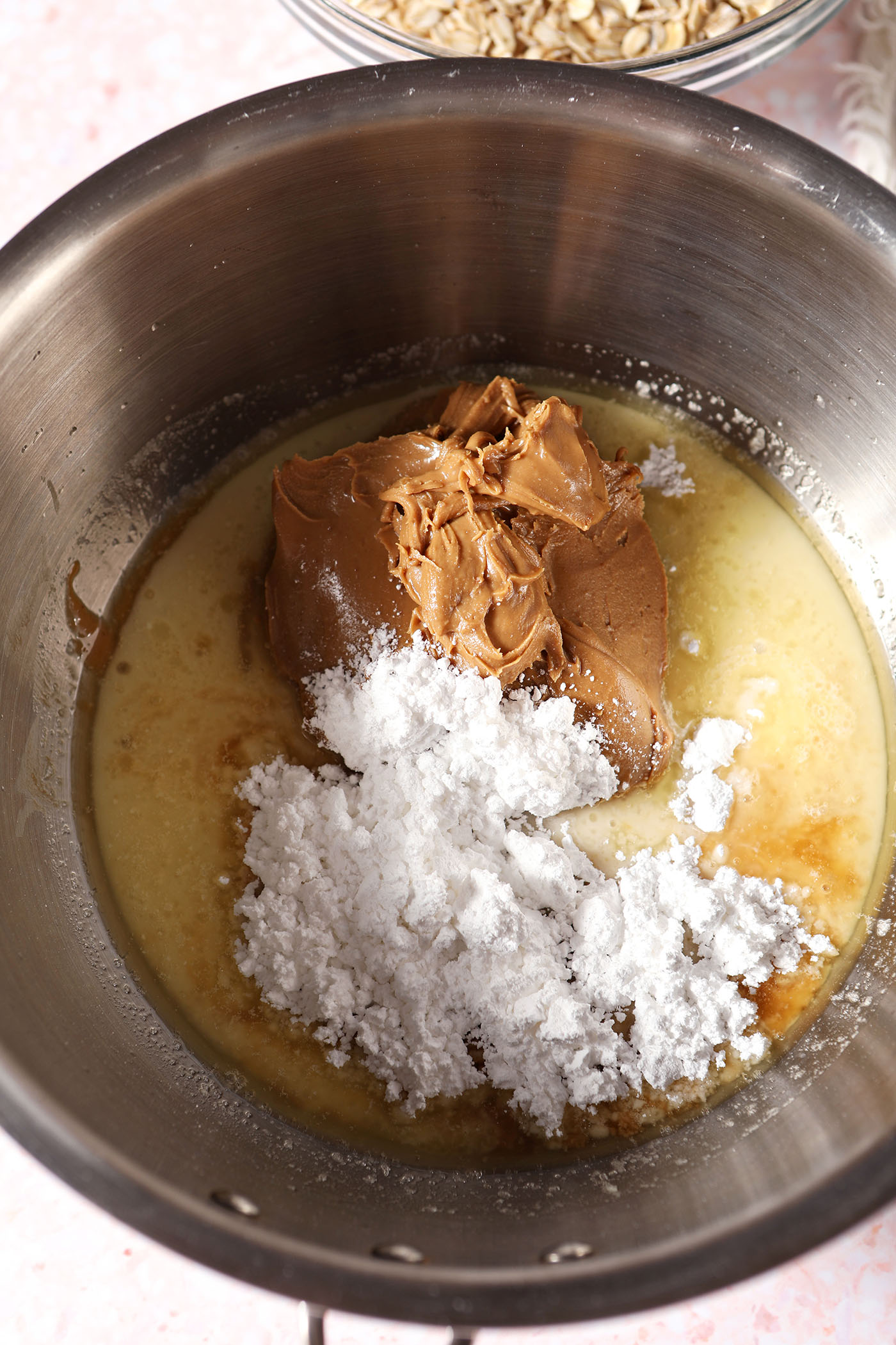 No bake cookie ingredients in a silver saucepan before mixing