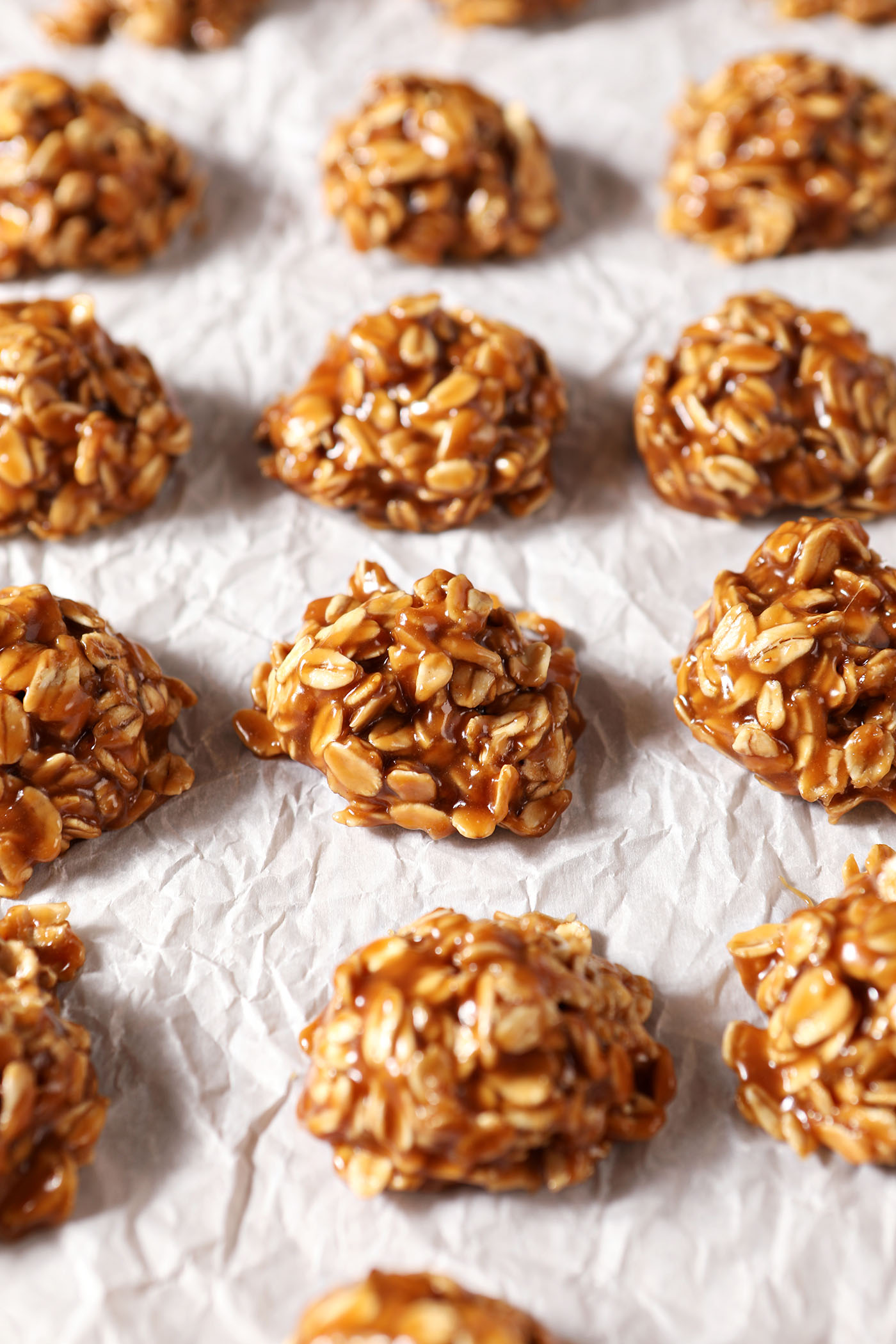 Scooped no bake cookie butter cookies on a parchment-lined sheet pan