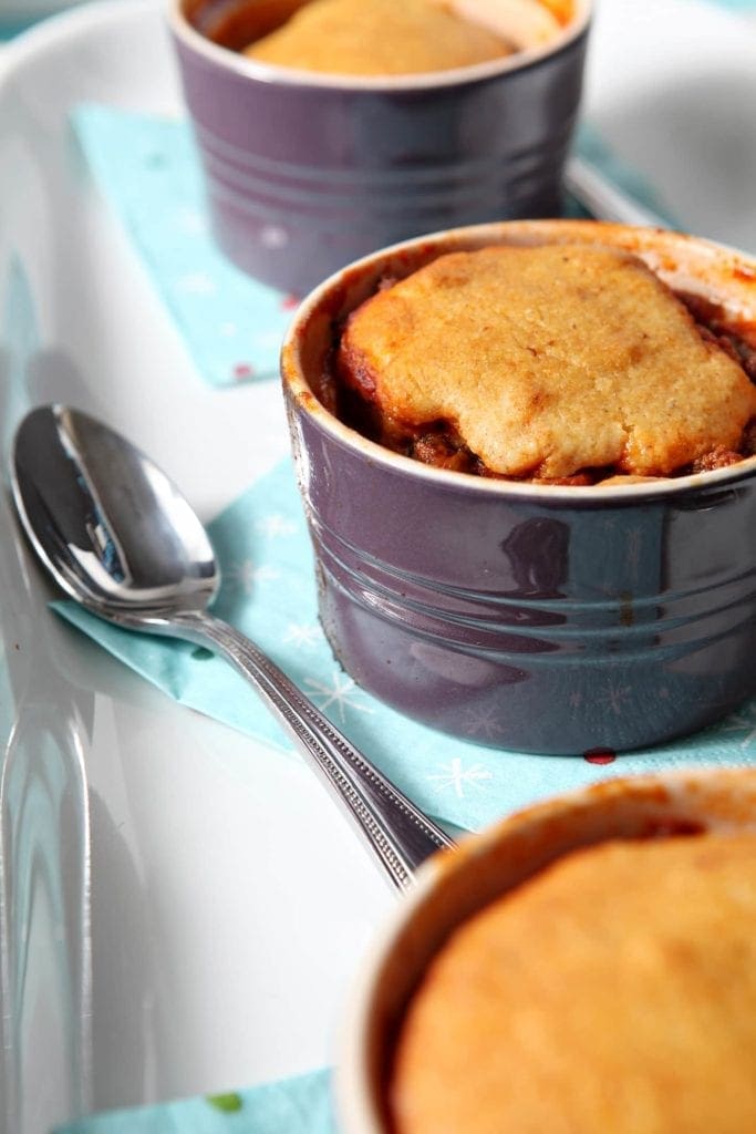 Bowl of chili cornbread pot pie with spoon 